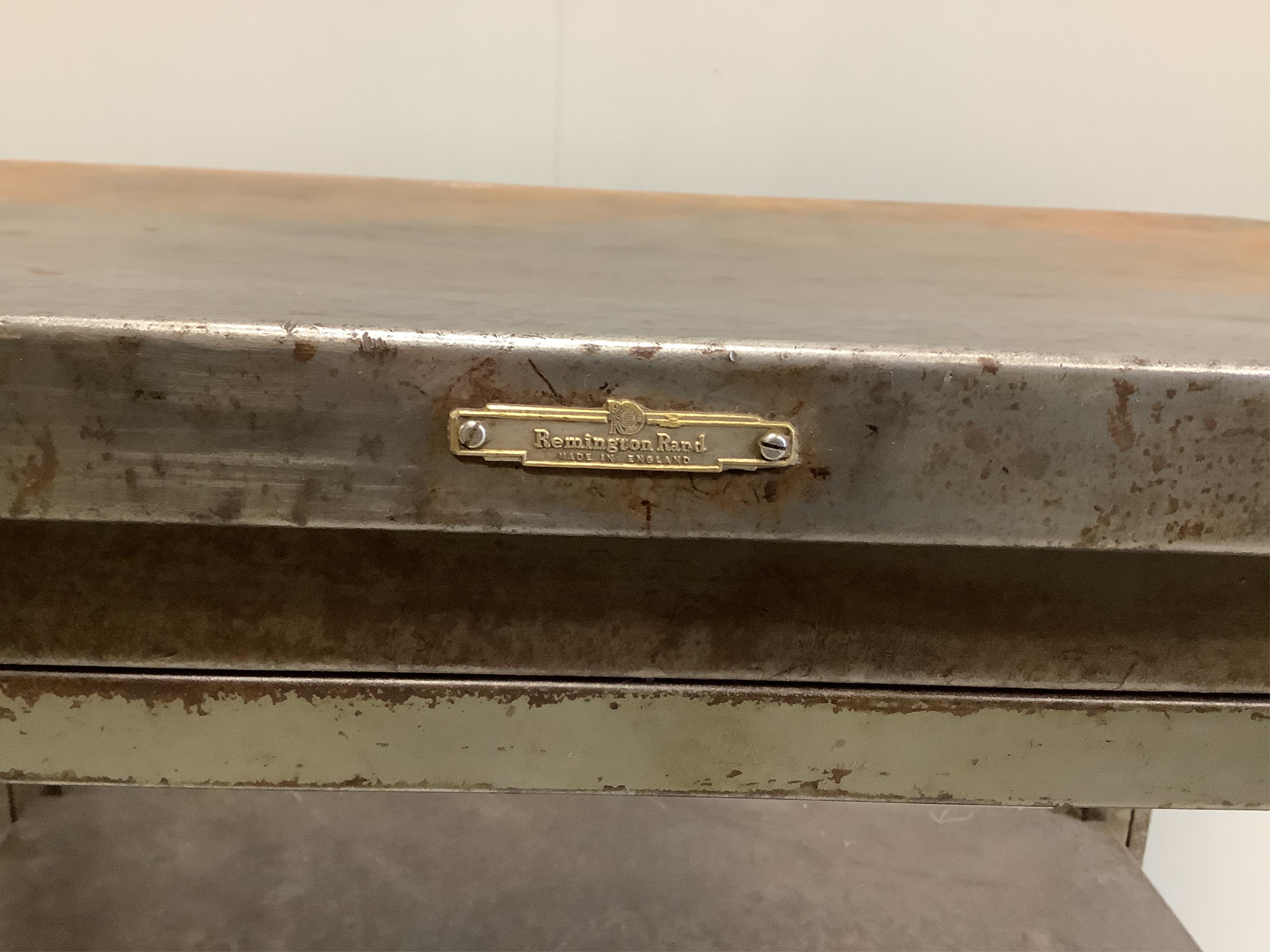 A mid century Remington Rand steel two tier work table with fitted slide, width 86cm, depth 64cm, height 71cm